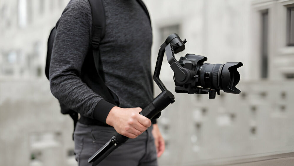 boy holding camera with gimbal