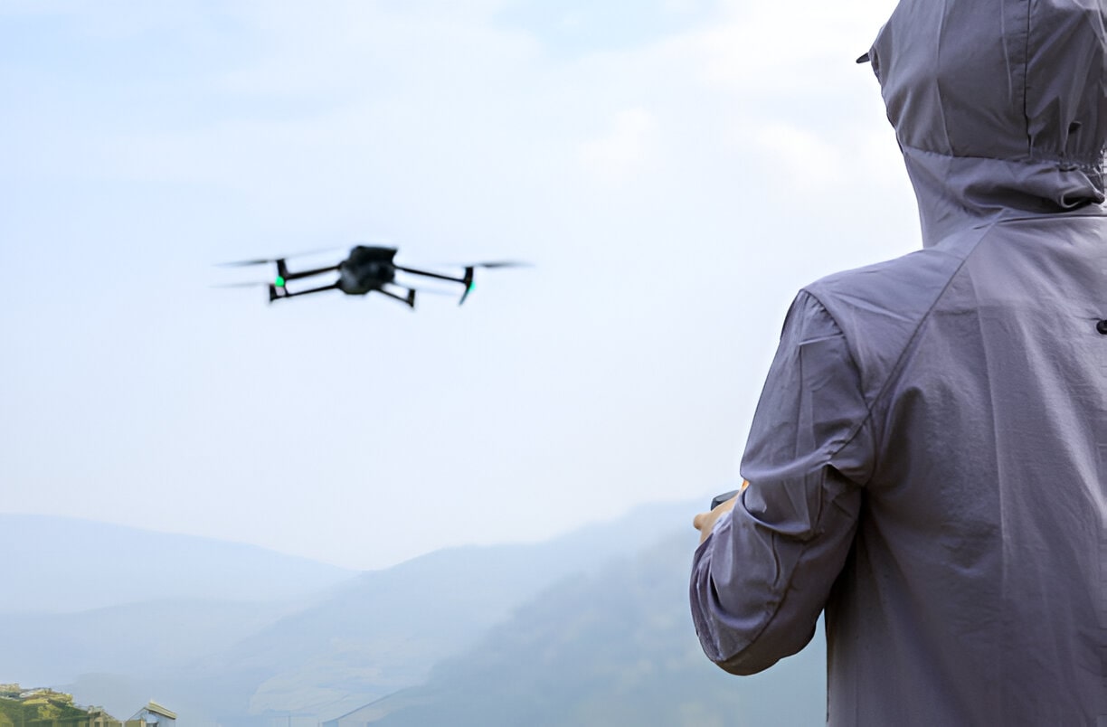 Flying drone in spring forest