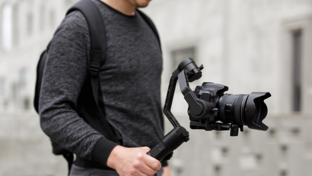 Camera gimbal stabilizer for smooth and steady videography, ideal for capturing professional-quality shots with ease and precision.