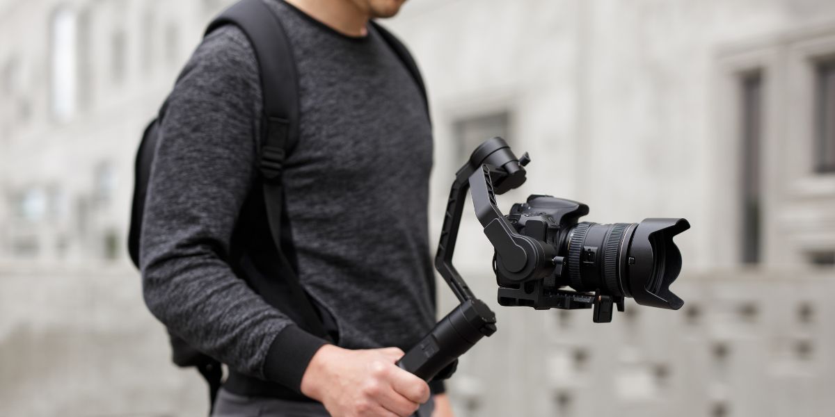 Camera gimbal stabilizer for smooth and steady videography, ideal for capturing professional-quality shots with ease and precision.